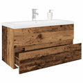 Waschbeckenunterschrank mit Einbaubecken und Wasserhahn